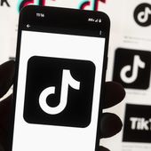 The TikTok logo is displayed on a mobile phone in front of a computer screen, Oct. 14, 2022, in Boston. (AP Photo/Michael Dwyer, File)