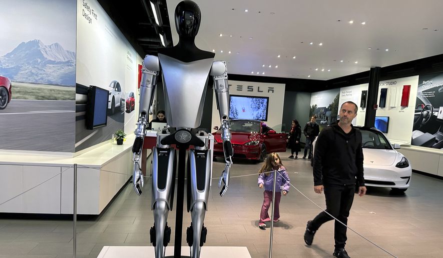 A non-working marketing model of Tesla Inc.&#x27;s proposed Optimus humanoid robot, aka Tesla Bot, is on display at the Westfield Garden State Plaza in Paramus, New Jersey, on Thursday, November 2, 2023. (AP Photo/Ted Shaffrey) **FILE**