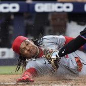 Miami Marlins catcher Nick Fortes, right, is unable to tag out Washington Nationals&#x27; CJ Abrams as he scores during the eighth inning of a baseball game, Friday, April 26, 2024, in Miami. Abrams and Trey Lipscomb scored on a single by Joey Meneses. (AP Photo/Wilfredo Lee) **FILE**