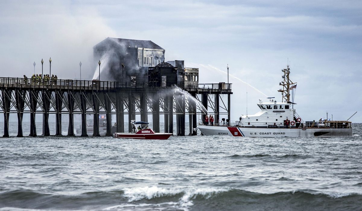 NextImg:Firefighters contain destructive fire on landmark wooden pier on the Southern California coast