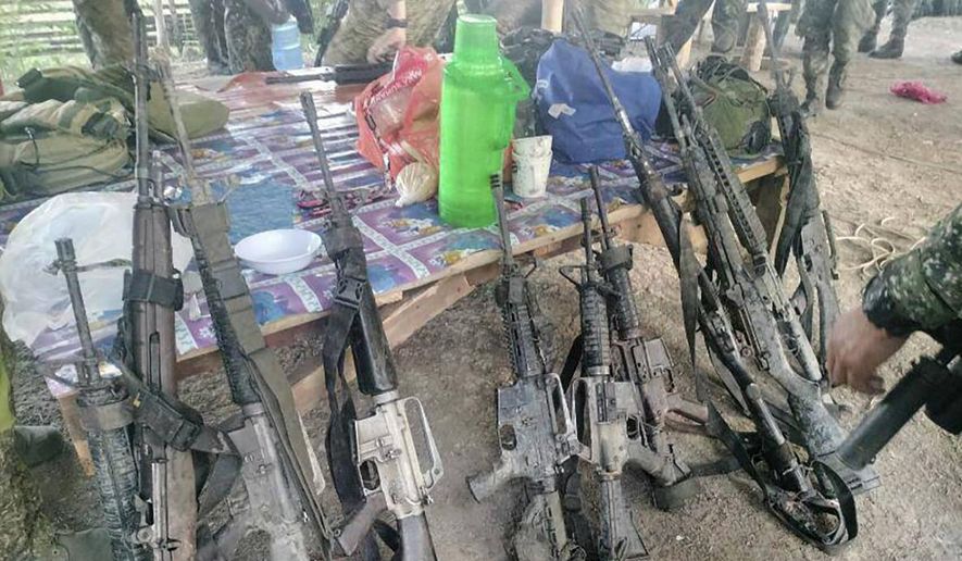 In this handout photo provided by the Philippine Army 6th Infantry Division, recovered firearms from suspected members of the Bangsamoro Islamic Freedom Fighters are seen after a gunbattle with Philippine troops at Datu Saudi Ampatuan town in Maguindanao del Sur province, southern Philippines, on April 22, 2024. Philippine forces killed an Abu Sayyaf militant, who had been implicated in past beheadings, including of 10 Filipino marines and two kidnapped Vietnamese, in a clash in the south, police officials said Friday, April 26. (Philippine Army 6th Infantry Division via AP, File)