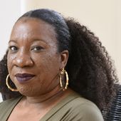 Tarana Burke, founder and leader of the #MeToo movement, sits in her home in Baltimore on Tuesday, Oct. 13, 2020. (AP Photo/Steve Ruark, File)
