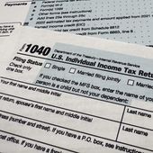 The Internal Revenue Service 1040 tax form for 2022 is seen on April 17, 2023. The IRS said Friday, April 26, 2024, more than 140,000 taxpayers filed their taxes through its new direct file pilot program. It says the program&#x27;s users claimed more than $90 million in refunds, saving roughly $5.6 million in fees they would have spent with commercial tax preparation companies. (AP Photo/Jon Elswick) **FILE**