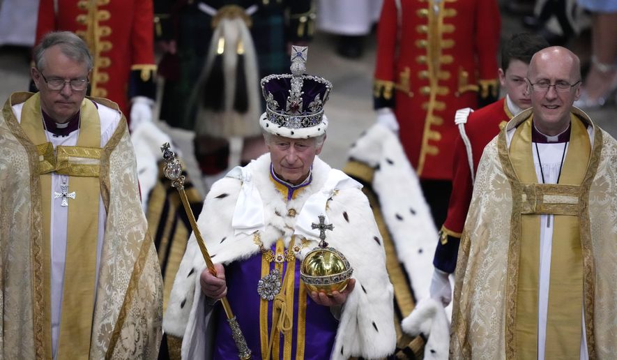 Britain&#x27;s King Charles III, center, walks in the Coronation Procession after his coronation ceremony at Westminster Abbey in London, May 6, 2023. King Charles III is on the comeback trail. The 75-year-old British monarch will slowly ease back into public life after a three-month break to focus on his treatment and recuperation after he was diagnosed with an undisclosed type of cancer. (AP Photo/Kirsty Wigglesworth, Pool, File)