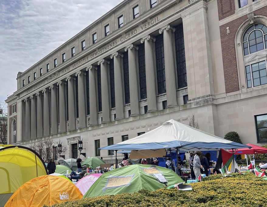 Pro-Palestinian protesters camp out in tents at Columbia University on Saturday, April 27, 2024 in New York. With the death toll mounting in the war in Gaza, protesters nationwide are demanding that schools cut financial ties to Israel and divest from companies they say are enabling the conflict. Some Jewish students say the protests have veered into antisemitism and made them afraid to set foot on campus. (AP Photo)