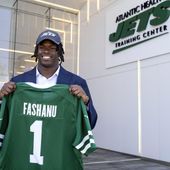 New York Jets offensive tackle Olu Fashanu holds his jersey at the team&#x27;s training facility in Florham Park, N.J., Friday, April 26, 2024. Fashanu, a Penn State offensive tackle, was selected at No. 11 overall by New York after the Jets traded down one spot Thursday night. (AP Photo/Craig Ruttle)
