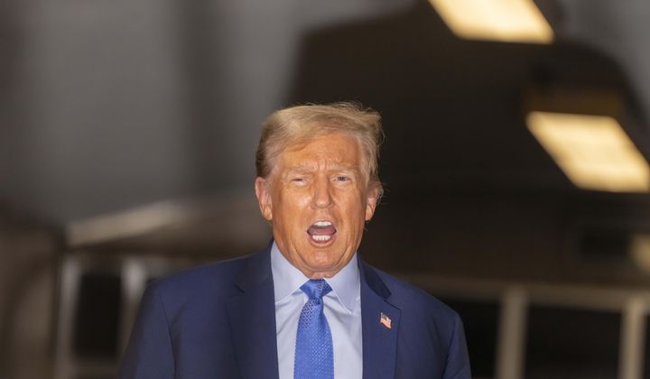 Former President Donald Trump speaks with the media at the end of the day&#x27;s proceedings in his trial at Manhattan criminal court , Friday, April 26, 2024, in New York. (Mark Peterson/Pool Photo via AP)