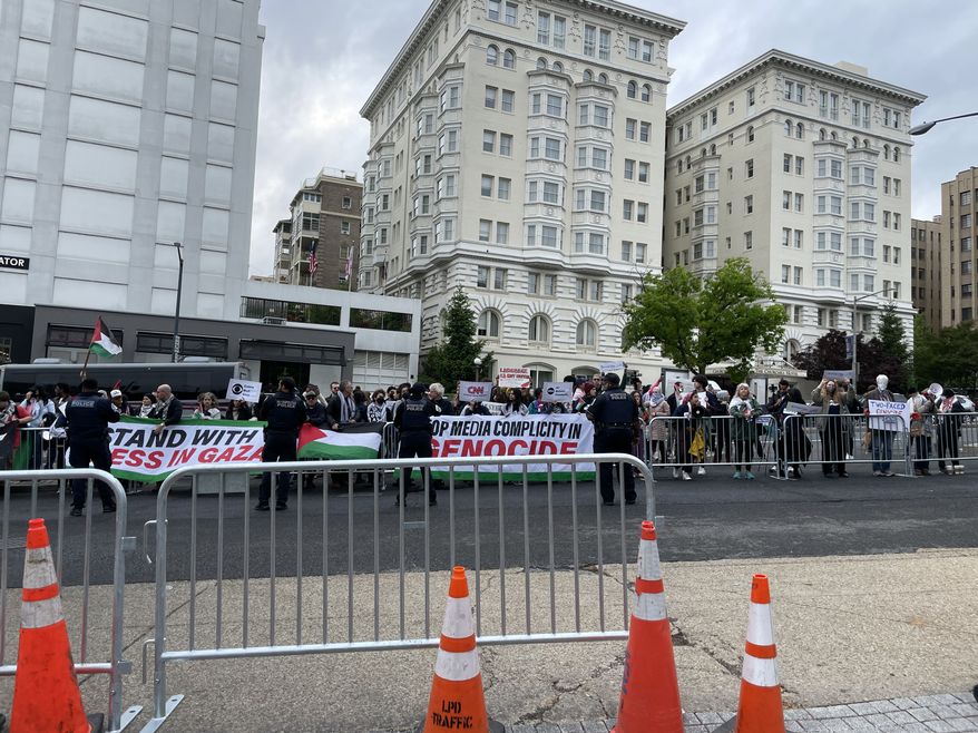 Protesters descended on The Washington Hilton Saturday where President Biden plans to speak at the annual White House Correspondents' Dinner. Photo credit: Kayla Wood / The Washington Times.