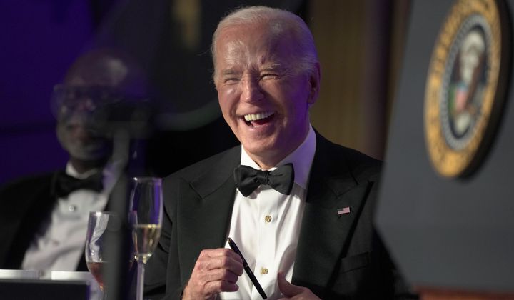 President Joe Biden laughs as host Colin Jost speaks at the White House Correspondents&#x27; Association Dinner at the Washington Hilton, Saturday, April 27, 2024, in Washington. (AP Photo/Manuel Balce Ceneta)