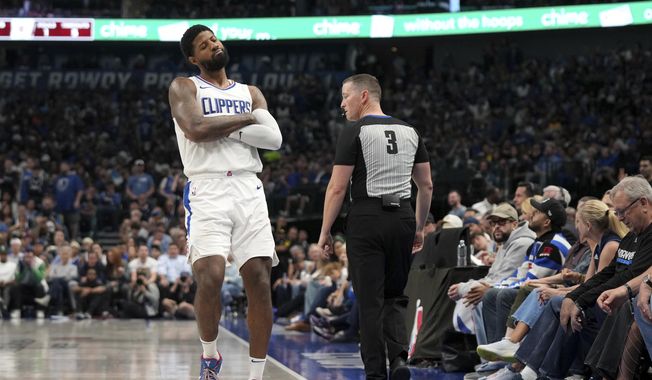 Los Angeles Clippers forward Paul George gestures to the crowd after shooting a 3-point basket during the first half of Game 4 of an NBA basketball first-round playoff series against the Dallas Mavericks, Sunday, April 28, 2024, in Dallas. (AP Photo/Jeffrey McWhorter)