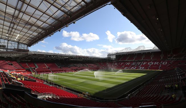 A general view of the Manchester United&#x27;s stadium Old Trafford, in Manchester, England, Aug. 10, 2018. A soccer fan has been arrested and charged for alleged tragedy chanting during Manchester United&#x27;s game against Burnley, Police said Sunday. (AP Photo/Jon Super, File)