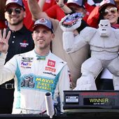 Denny Hamlin, front left, celebrates in Victory Lane after winning a NASCAR Cup Series auto race at Dover Motor Speedway, Sunday, April 28, 2024, in Dover, Del. (AP Photo/Derik Hamilton)
