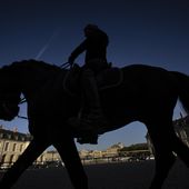 A horsewoman trains with her horse in the main courtyard of the royal stables, in Versailles, Thursday, April 25, 2024. More than 340 years after the royal stables were built under the reign of France&#x27;s Sun King, riders and horses continue to train and perform in front of the Versailles Palace. The site will soon keep on with the tradition by hosting the equestrian sports during the Paris Olympics. Commissioned by King Louis XIV, the stables have been built from 1679 to 1682 opposite to the palace&#x27;s main entrance. (AP Photo/Aurelien Morissard)