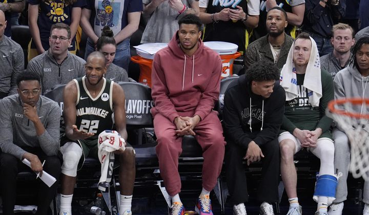 Milwaukee Bucks&#x27; Giannis Antetokounmpo, middle, watches along with teammates during the second half of Game 4 of the first round NBA playoff basketball series against the Indiana Pacers, Sunday, April 28, 2024, in Indianapolis. (AP Photo/Michael Conroy) **FILE**