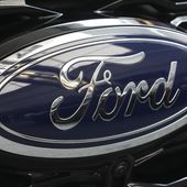 The Ford logo is seen on the grill of a Ford Explorer on display at the Pittsburgh International Auto Show in Pittsburgh, on Feb. 15, 2024. Two fatal crashes involving Ford’s Blue Cruise partially automated driving system have drawn the attention of U.S. auto safety regulators. (AP Photo/Gene J. Puskar, File)