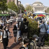 Student protesters march round their encampment on the Columbia University campus, Monday, April 29, 2024, in New York. (AP Photo/Stefan Jeremiah)