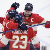 Florida Panthers center Aleksander Barkov (16) and left wing Matthew Tkachuk, left, congratulate center Carter Verhaeghe (23) after Verhaeghe scored a goal during the third period of Game 5 of the first-round of an NHL Stanley Cup Playoff series against the Tampa Bay Lightning, Monday, April 29, 2024, in Sunrise, Fla. (AP Photo/Wilfredo Lee)