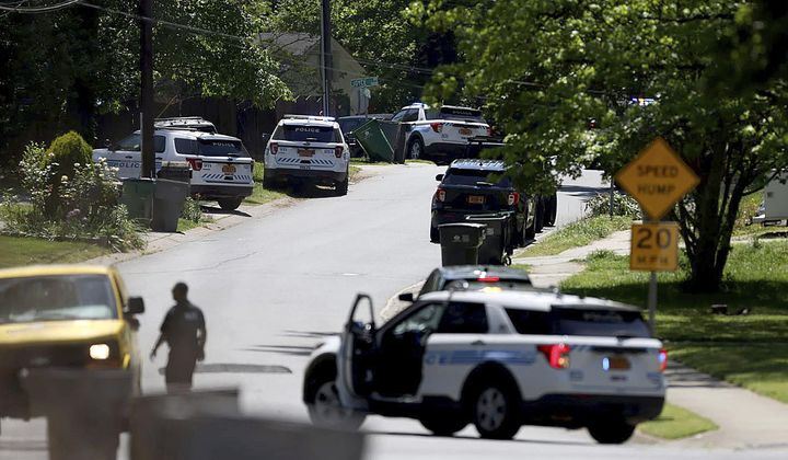 Police work at the scene of a shooting Monday, April 29, 2024, in east Charlotte, N.C. Officers from the U.S. Marshals Task Force were conducting an investigation in a suburban neighborhood when they were fired upon, the CMPD said in a post on X. (Khadejeh Nikouyeh/The Charlotte Observer via AP)