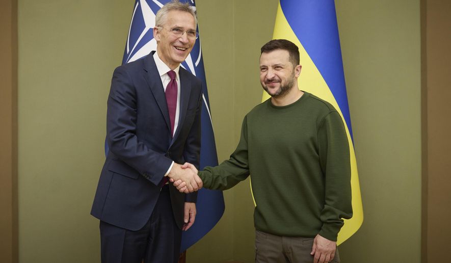 Ukrainian President Volodymyr Zelenskyy, right, welcomes NATO Secretary-General Jens Stoltenberg during their meeting in Kyiv, Ukraine, Monday, April 29, 2024. (Ukrainian Presidential Press Office via AP)