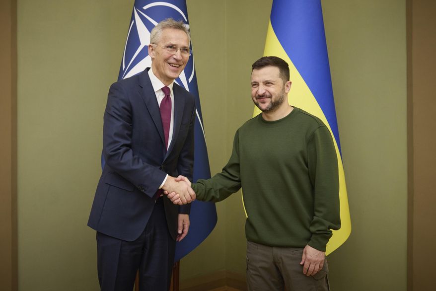Ukrainian President Volodymyr Zelenskyy, right, welcomes NATO Secretary-General Jens Stoltenberg during their meeting in Kyiv, Ukraine, Monday, April 29, 2024. (Ukrainian Presidential Press Office via AP)