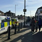 The area in London where police say a man wielding a sword attacked members of the public and two police officers on Tuesday, April 30, 2024, in the east London community of Hainault before being arrested. The incident is not being treated as terror-related. (Peter Kingdom via AP)