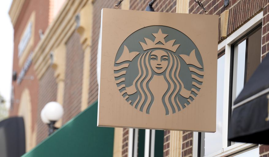 Starbucks sign hangs along Main Street Wednesday, Sept. 20, 2023, in Deadwood, S.D. Four Starbucks in Ashburn, Virginia, were vandalized overnight with anti-Israel, pro-Palestinian graffiti, according to the Loudoun County Sheriff's Department. (AP Photo/David Zalubowski)