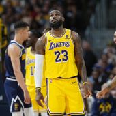 Los Angeles Lakers forward LeBron James (23) checks the scoreboard in the first half of Game 5 of an NBA basketball first-round playoff series against the Denver Nuggets, Monday, April 29, 2024, in Denver. (AP Photo/David Zalubowski)
