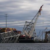The collapsed Francis Scott Key Bridge lays on top of the container ship Dali, Thursday, April 25, 2024, in Baltimore. (AP Photo/Matt Rourke)