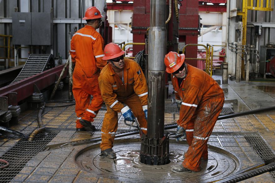 Pemex oil workers set the drill on the Centenario deep-water drilling platform in the Gulf of Mexico off the coast of Veracruz, Mexico, Nov. 22, 2013. The 1938 nationalization of Mexico's oil sector from U.S. and British companies is a point of pride for millions of Mexicans. (AP Photo/Dario Lopez-Mills) **FILE**