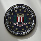 An FBI seal is seen on a wall on Aug. 10, 2022, in Omaha, Neb. The FBI says scammers stole more than $3.4 billion from older Americans last year. An FBI report released Tuesday shows a rise in losses through increasingly sophisticated tactics to trick the vulnerable into giving up their life savings. (AP Photo/Charlie Neibergall, File)