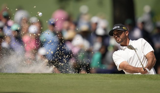 Jason Day, of Australia, hits from the bunker on the seventh hole during second round at the Masters golf tournament at Augusta National Golf Club Friday, April 12, 2024, in Augusta, Ga. Day is the defending champion and two-time winner of an event fellow major champion Jordan Spieth would dearly like to win -- Spieth&#x27;s hometown CJ Cup Byron Nelson golf tournament. They are the headliners in a field missing most of the big names, including soon-to-be-father Scottie Scheffler. (AP Photo/Ashley Landis, File)