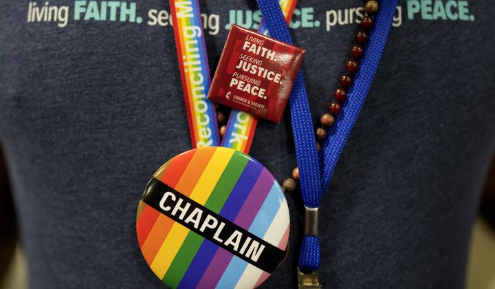 A convention goer wears a button supporting LGBTQ clergy at the United Methodist Church General Conference Wednesday, May 1, 2024, in Charlotte, N.C. United Methodist delegates repealed their church’s longstanding ban on LGBTQ clergy with no debate on Wednesday, removing a rule forbidding “self-avowed practicing homosexuals” from being ordained or appointed as ministers. (AP Photo/Chris Carlson)