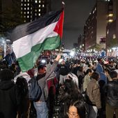 Pro-Palestinian protesters gather near an area where people were being taken into custody near the Columbia University campus in New York, Tuesday, April 30, 2024, after a campus encampment and a campus building, taken over by protesters earlier in the day, were cleared by New York City police. (AP Photo/Craig Ruttle)