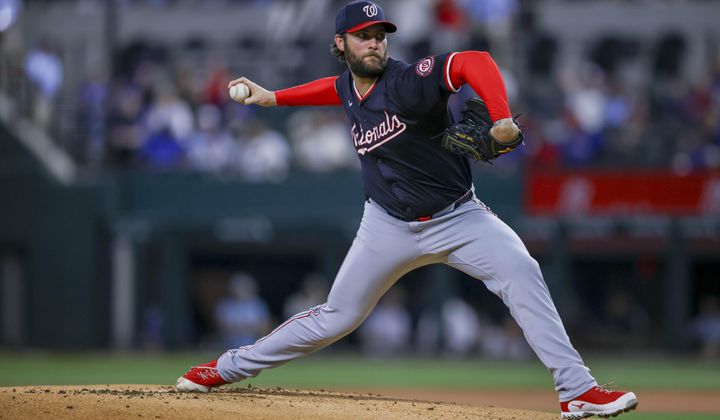 Washington Nationals starting pitcher Trevor Williams delivers during the first inning of a baseball game against the Texas Rangers in Arlington, Texas, Wednesday, May 1, 2024. (AP Photo/Gareth Patterson)