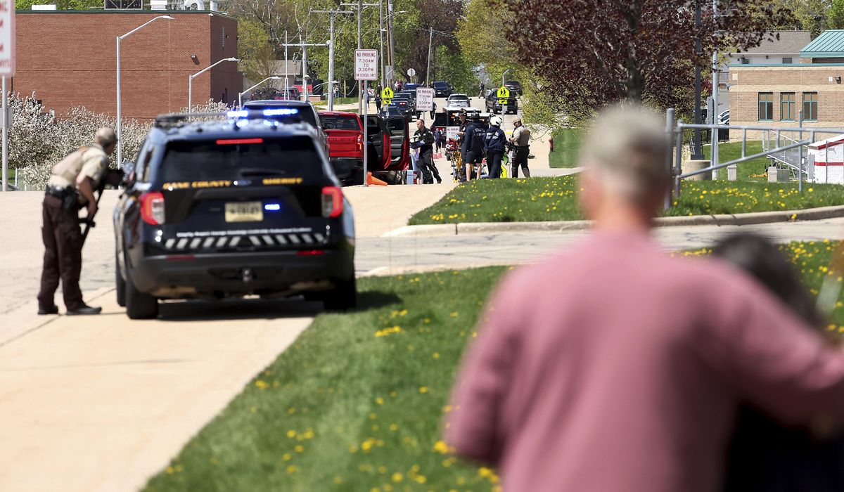 NextImg:Investigators say student killed by police outside Wisconsin school had pointed pellet rifle