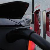 A vehicle charges at a Tesla Supercharger station in Detroit, Nov. 16, 2022. Elon Musk’s move to lay off the department responsible for Tesla’s electric vehicle charging network has touched off worries in the auto industry about plans to open the chargers to EVs made by other automakers. Several leaders of Tesla’s Supercharger team posted social media messages saying they were told Monday, April 29, 2024, that entire group of about 500 had been eliminated by CEO Musk. (AP Photo/Paul Sancya) **FILE**