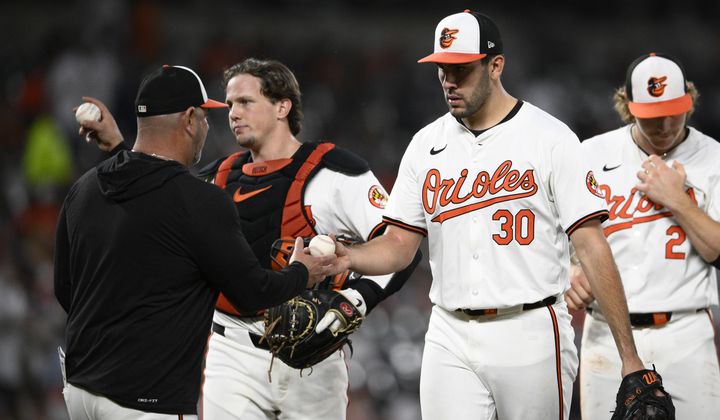 Baltimore Orioles starting pitcher Grayson Rodriguez (30) is pulled by manager Brandon Hyde, left, during the sixth inning of a baseball game against the New York Yankees, Monday, April 29, 2024, in Baltimore. (AP Photo/Nick Wass) **FILE**