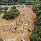 In this photo released by Xinhua News Agency, an aerial drone photo taken on May 2, 2024 shows rescuers and excavators working at the site of a highway section that collapsed on the Meizhou-Dabu Expressway in Meizhou, south China&#x27;s Guangdong Province. The death toll has climbed as search efforts continue in southern China after a highway section collapsed in a mountainous area, sending more a dozen cars down a steep slope. (Wang Ruiping/Xinhua via AP)