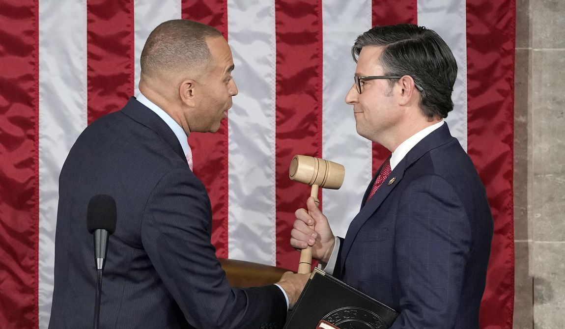 House Minority Leader Hakeem Jeffries of N.Y., hands the gavel to speaker-elect Rep. Mike Johnson, R-La., at the Capitol in Washington, Oct. 25, 2023. In a historic vote, 163 Democrats voted to save Republican House Speaker Mike Johnson from a move to push him out by an ultra-right conservative who believes he capitulated to the left. (AP Photo/Alex Brandon, File)