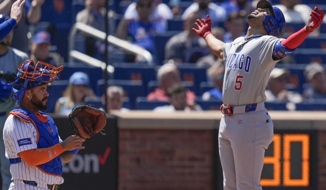 New York Mets catcher Omar Narváez, left, watches as Chicago Cubs&#x27; Christopher Morel crosses home plate after hitting a three-run homer during the fifth inning of a baseball game at Citi Field, Thursday, May 2, 2024, in New York. (AP Photo/Seth Wenig)