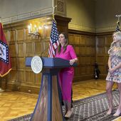 Arkansas Gov. Sarah Huckabee Sanders speaks at a news conference next to former Kentucky swimmer Riley Gaines at the state Capitol in Little Rock, Ark., Thursday, May 2, 2024. Sanders spoke before signing an executive order stating that Arkansas won&#x27;t comply with new federal regulations intended to protect the rights of transgender students. (AP Photo/Andrew DeMillo)