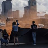 Activists block a highway as they demand the release of the hostages from Hamas captivity in the Gaza Strip, in Tel Aviv, Israel, Thursday, May 2, 2024. (AP Photo/Oded Balilty)
