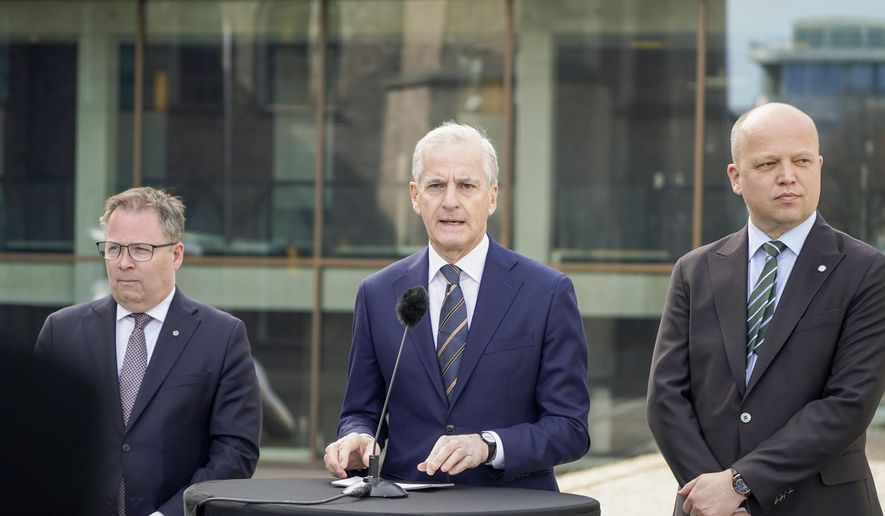 Norway's Prime Minister Jonas Gahr Støre, center, Finance Minister Trygve Slagsvold Vedum, right and Defense Minister Bjørn Arild Gram, take part in a press conference on defense at SMK, in Oslo, Thursday, May 2, 2024. The Norwegian center-left government wants to add 7 billion kroner ($630 million) to the Scandinavian country’s Armed Forces on top of the hefty increase of the defense budget announced last month. (Terje Pedersen /NTB Scanpix via AP)
