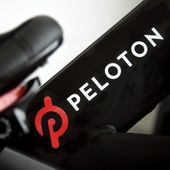 This Nov. 19, 2019, file photo shows the logo on a Peloton bike in San Francisco. Peloton is cutting about 400 jobs worldwide as part of a restructuring effort and its CEO Barry McCarthy is stepping down after two years as the company continues to work on turning around its business. Peloton Interactive Inc. said Thursday, May 2, 2024, that the job reductions amount to approximately 15% of its global headcount. (AP Photo/Jeff Chiu, File)