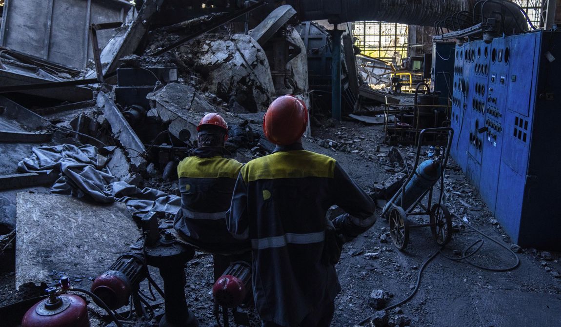 Workers stand among debris in a damaged DTEK thermal power plant after a Russian attack in Ukraine, Thursday, May 2, 2024. Ukrainian energy workers are struggling to repair the damage from intensifying airstrikes aimed at pulverizing Ukraine&#x27;s energy grid, hobbling the economy and sapping the public&#x27;s morale. (AP Photo/Francisco Seco)
