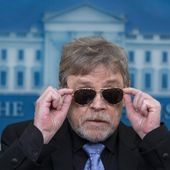 Actor Mark Hamill takes off sunglasses given to him by President Joe Biden, as he joins White House press secretary Karine Jean-Pierre as she speaks with reporters in the James Brady Press Briefing Room at the White House, Friday, May 3, 2024, in Washington. (AP Photo/Alex Brandon)