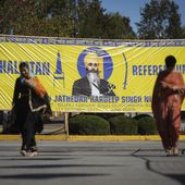 A banner that shows the late Sikh separatist leader Hardeep Singh Nijjar is displayed outside the Guru Nanak Sikh Gurdwara Sahib in Surrey, British Columbia, Sept. 18, 2023, where he was gunned down in his vehicle while leaving the temple parking lot. Canadian police said Friday, May 3, 2024, that they have made three arrests in the June slaying. (Darryl Dyck/The Canadian Press via AP, File)