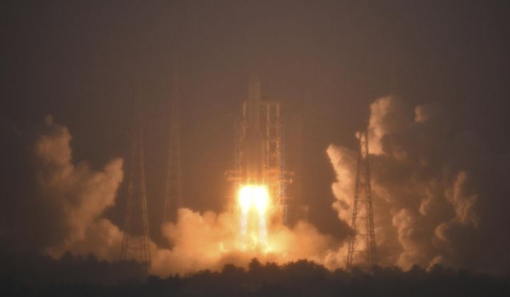 In this photo provided by China&#x27;s Xinhua News Agency, a Long March-5 rocket, carrying the Chang&#x27;e-6 spacecraft, blasts off from its launchpad at the Wenchang Space Launch Site in Wenchang, south China&#x27;s Hainan Province, Friday, May 3, 2024. China on Friday launched a lunar probe to land on the far side of the moon and return with samples that could provide insights into differences between the less-explored region and the better-known near side. (Guo Cheng/Xinhua via AP)