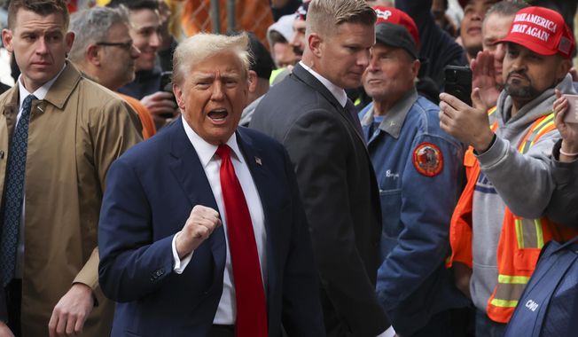 Former President Donald Trump reacts while meeting with construction workers at the construction site of the new JPMorgan Chase headquarters in midtown Manhattan, Thursday, April 25, 2024, in New York. Trump met with construction workers and union representatives hours before he&#x27;s set to appear in court. (AP Photo/Yuki Iwamura)