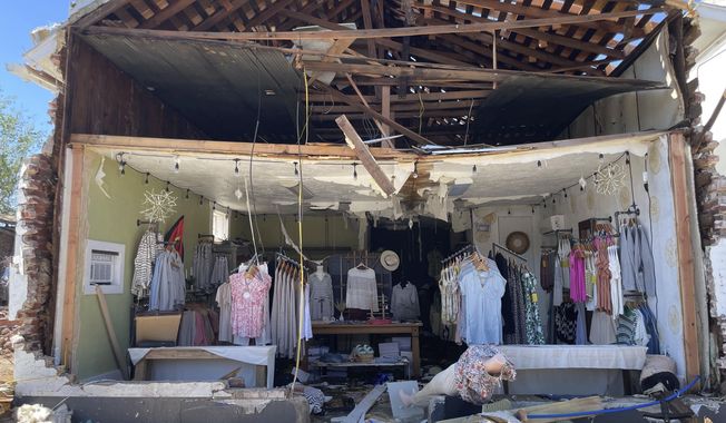 A clothing store in downtown Sulphur, Okla., is left without a wall on Monday, April 29, 2004, after a tornado plowed through the rural Oklahoma community and left wide destruction throughout downtown. (AP Photo/Graham Lee Brewer)